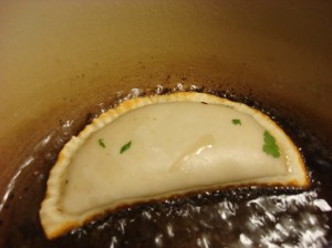 See the soft bubbling around the empanada? That's what you are looking for when you fry. Make sure the edge gets immersed on both sides!