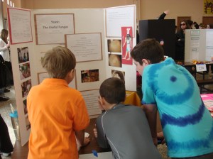 Explaining it to the boys (while they noshed on fresh bread)